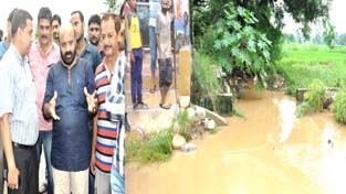 Minister for Forests, Bali Bhagat taking stock of damages due to floods at Mishriwala on Friday.