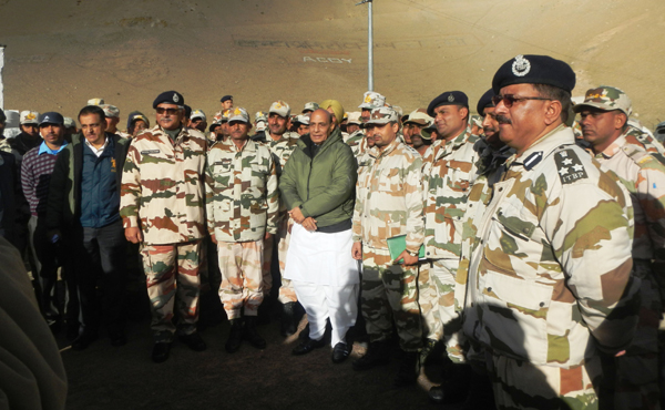 Union Home Minister Rajnath Singh poses with officers at a forward post in Leh on Wednesday.