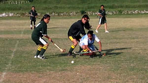 Players in action in Inter Collegiate Hockey Tournament at University of Jammu on Wednesday.