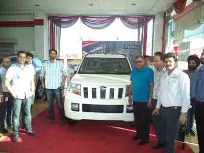 Officials of Astro India Automobile Private Limited unveiling new SUV TUV 300 at Jammu on Thursday.