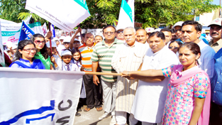 MP Shamsher Singh Manhas, MLA Sat Sharma and Commissioner JMC Mandeep Kaur flagging off a rally at Jammu on Monday.