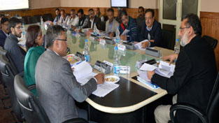 Finance Minister, Dr Haseeb A Drabu chairing a meeting at Srinagar on Tuesday.