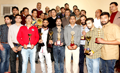Winners of various titles in 23rd Jammu District Junior and Senior Billiards and Snooker Championship posing for a group photograph alongwith chief guest MLA East Rajesh Gupta and other dignitaries in Jammu on Saturday. -Excelsior/ Rakesh