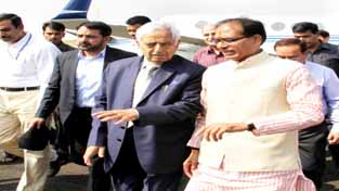 Chief Minister Mufti Mohd Sayeed interacting with his Madhya Pradesh counterpart at Bhopal airport on Friday.