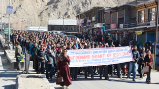 State Govt employees taking out protest march in Leh town on Tuesday. -Excelsior/ Stenzin