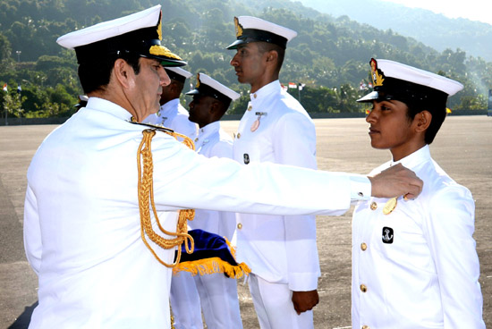 Chief of the Naval Staff Admiral R K Dhowan awarding ‘Chief of the Naval Staff Gold Medal’ for the cadet adjudged first in overall order-of-merit for the Naval Orientation (Regular) Course to women cadet Darshita Babu of Kerala, during passing out parade at Indian Naval Academy (INA), Kannur on Thursday. (UNI )