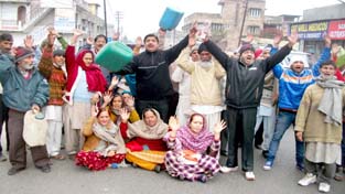 Activists of Jammu West Assembly Movement holding protest on Monday.