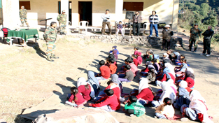 An Army officer delivering a lecture on health and sanitation at GMS Danna.