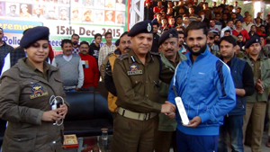 Winner receiving man of the match award during a quarterfinal match of 6th Police Martyrs Memorial Inter-Club NZ T20 Tournament at Sports Stadium, Kathua.