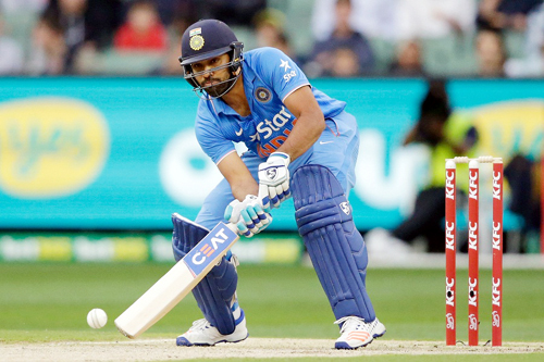 Rohit Sharma trying to scoop the ball towards fine-leg area during Second T20 Match against Australia at Melbourne on Friday.