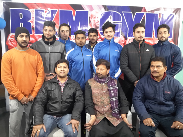 Selected State Powerlifters posing along with Minister for Health and Medical Education Lal Singh and other dignitaries in Jammu.