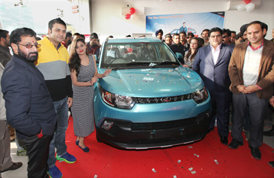 Dignitaries during the launch of new Mahindra KUV 100 at Shuhul Automobiles,Narwal in Jammu. —Excelsior/Rakesh
