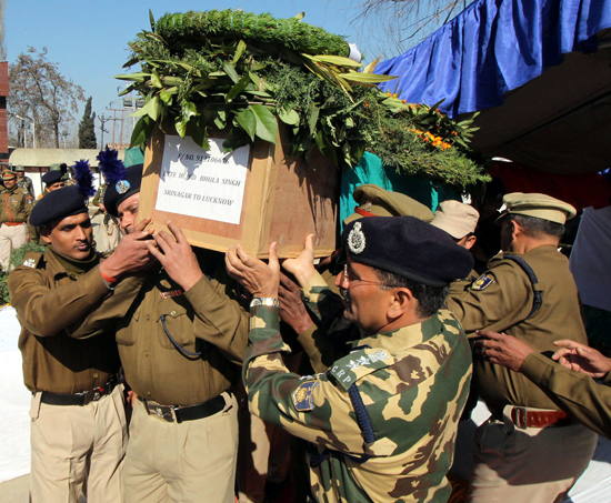 CRPF personnel carry coffin of Head Constable R K Rana who lost his life in a gun battle with militants near J&K Entrepreneurship Development Institute (JKEDI) building during a gunfight between militants and security forces in Pampore. -Excelsior/ Younis Khaliq