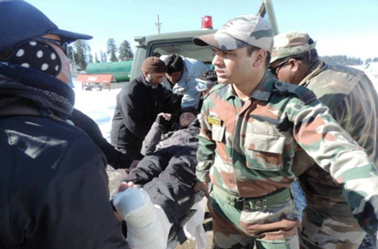 Army personnel shifting the Russian skier for medical check up in Gulmarg on Sunday.