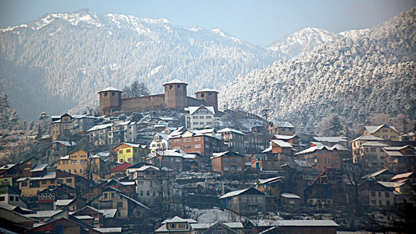 After a long dry spell, Bhaderwah valley received first snowfall in the town on Friday. (UNI)