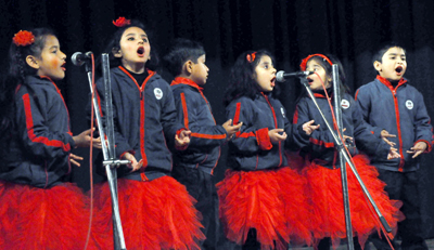 Kids presenting singing item while celebrating Annual Day Function at Zorawar Singh Auditorium, University of Jammu on Friday.