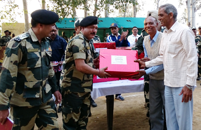 Officers of 9 Bn BSF presenting stationery items to Govt High school, Chaksadda in border belt of Samba District.