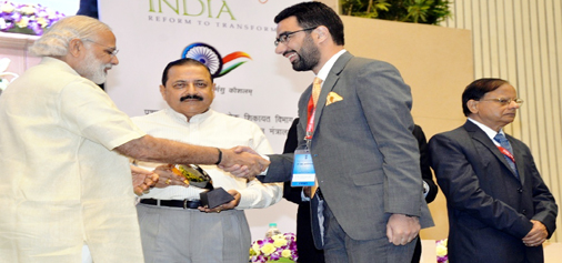 DC Anantnag Dr Syed Abid Rasheed Shah receiving Excellence award from Prime Minister Narendra Modi in New Delhi on Thrusday.