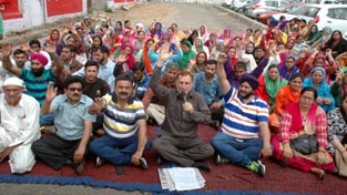 Anganwadi workers and helpers of ICDS staging protest dharna in Jammu on Monday. -Excelsior/ Rakesh