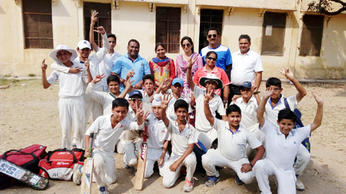 Cricket players of Gandhi Nagar Zone posing for photograph after winning match against Satwari Zone.
