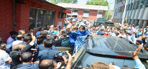 Chief Minister Mehbooba Mufti waves to crowd before filing her nomination papers in Anantnag on Wednesday. —Excelsior/Younis Khaliq