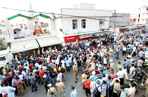People holding massive protests at Nanak Nagar, Jammu against sacrilegious act on Thursday. — Excelsior/Rakesh