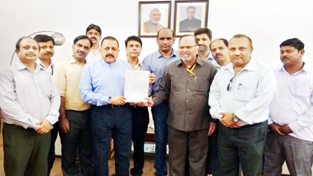 Union Minister Dr Jitendra Singh receiving a memorandum from a delegation of CPWD Engineers, at North Block, New Delhi on Thursday.
