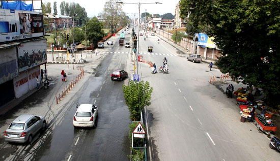 Few vehicles move on a Srinagar city road after curfew was lifted on Thursday. -Excelsior/ Shakeel