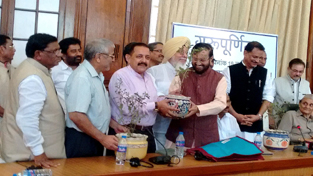 Union Minister Dr Jitendra Singh, who is also an eminent Professor of Diabetes / Medicine, being felicitated by Union HRD Minister Prakash Javadekar on the occasion of Guru Purnima in Parliament House, at New Delhi on Tuesday.