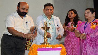 Minister for Health, Bali Bhagat lighting a traditional lamp on the occasion of Doctor's Day celebrations.
