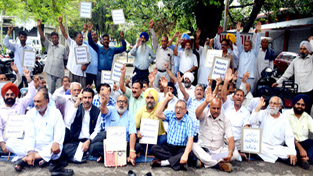 Civil society members protesting at Jammu on Monday.