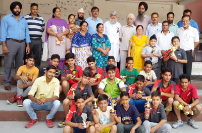 Winners and participants of Table Tennis Tournament posing for group photograph.