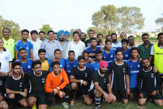 Participants of football tournament posing for photograph with MLA Jammu East Rajesh Gupta and others.