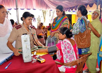 An Army doctor examining patients during ‘Health Mela’ by Cross Swords Division at Akhnoor.
