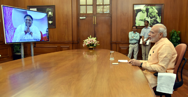Prime Minister, Narendra Modi interacting with Mata Amritanandamayi ‘Amma’, through video conferencing, in New Delhi on Tuesday.