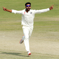 Ravindra Jadeja celebrates after taking a wicket during a Duleep Trophy match.