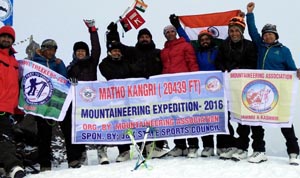 Participants of mountaineering expedition posing for group photograph.