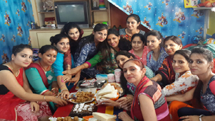 Teachers having a tea party on the occasion of Teachers’ Day in a school.