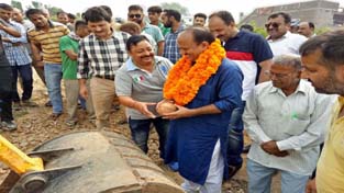 MLA Samba Dr Devinder Manyal kick starting construction of road in village Chowadhi on Wednesday. —Excelsior/Gautam