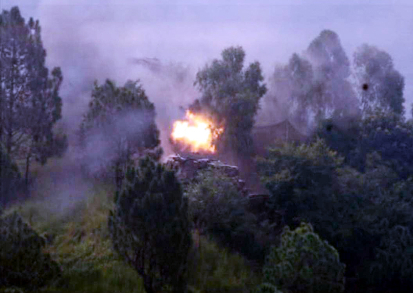 A Pakistani post caught fire after being hit by Indian troops across Mendhar on Wednesday.