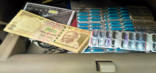 Old currency notes and banned capsules seized by police at Lakhanpur on Sunday.