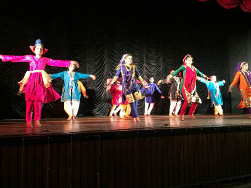 Natrang artists presenting a dance performance in the auditorium of CTM Kathua.