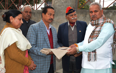 Minister for PHE Sham Lal Choudhary honouring family of martyr on Friday.