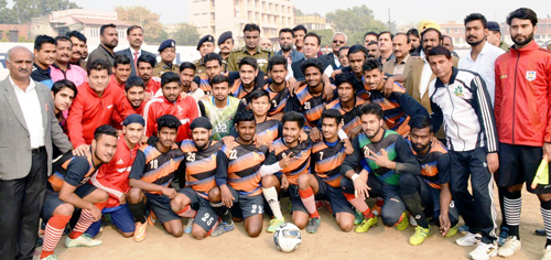 Participating teams posing alongwith Minister of State for Sports, Sunil Kumar Sharma and IGP Jammu, Danish Rana during inaugural function of Christmas Soccer Championship.