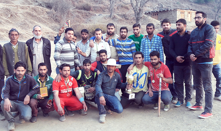Winners of 3rd Jamsheed Khan Memorial Cricket Tournament posing for a group photograph alongwith the dignitaries at Doda.