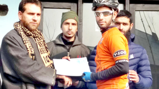 Winner of District Budgam Cycling Championship being felicitated by the chief guest on Thursday.