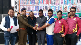 Winner of the Man of the Match award being felicitated by the chief guest at Sports Stadium in Kathua.