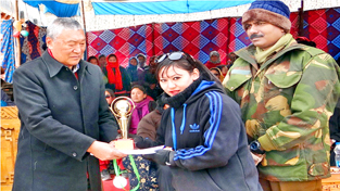 Winner being felicitated by the chief guest during concluding ceremony of Sports Festival at Leh. -Excelsior/Stanzin