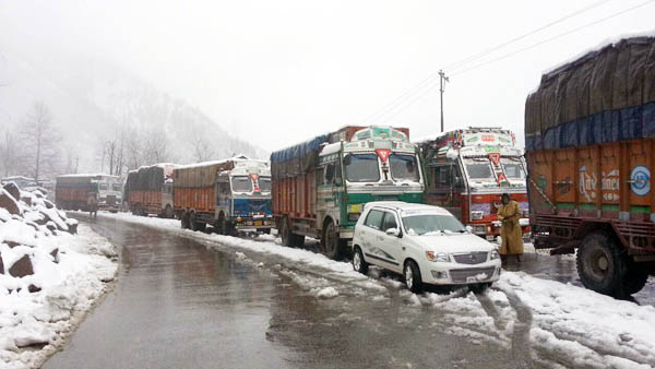 Trucks stranded on Jammu-Srinagar National Highway in Banihal on Saturday. —Excelsior/Parvez