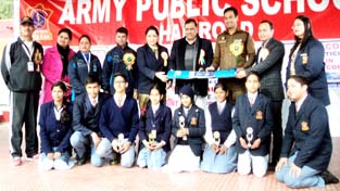 Winners of Symposium, Painting and Debate Competitions posing alongwith the chief guest and other dignitaries at APS Dhar Road in Udhampur on Saturday.